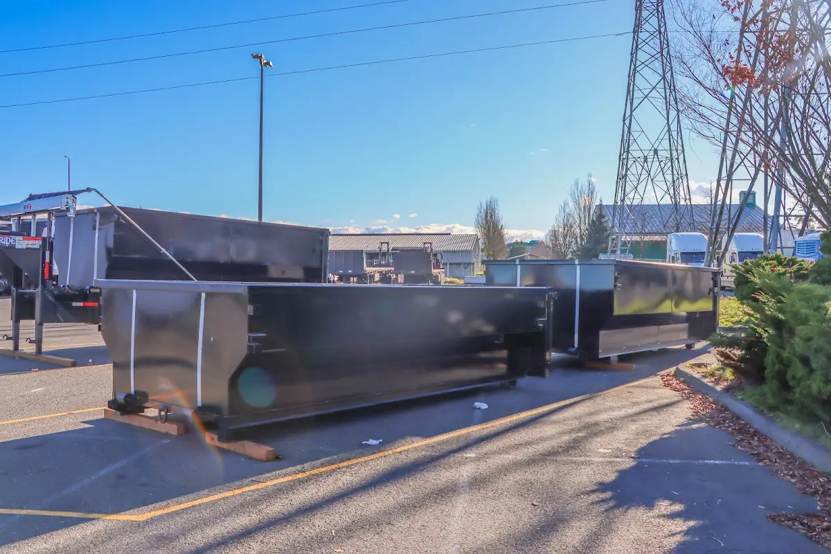 Roll-off dumpster ready for waste disposal at job site for 3 Yard Dumpster Rental in Iowa Colony